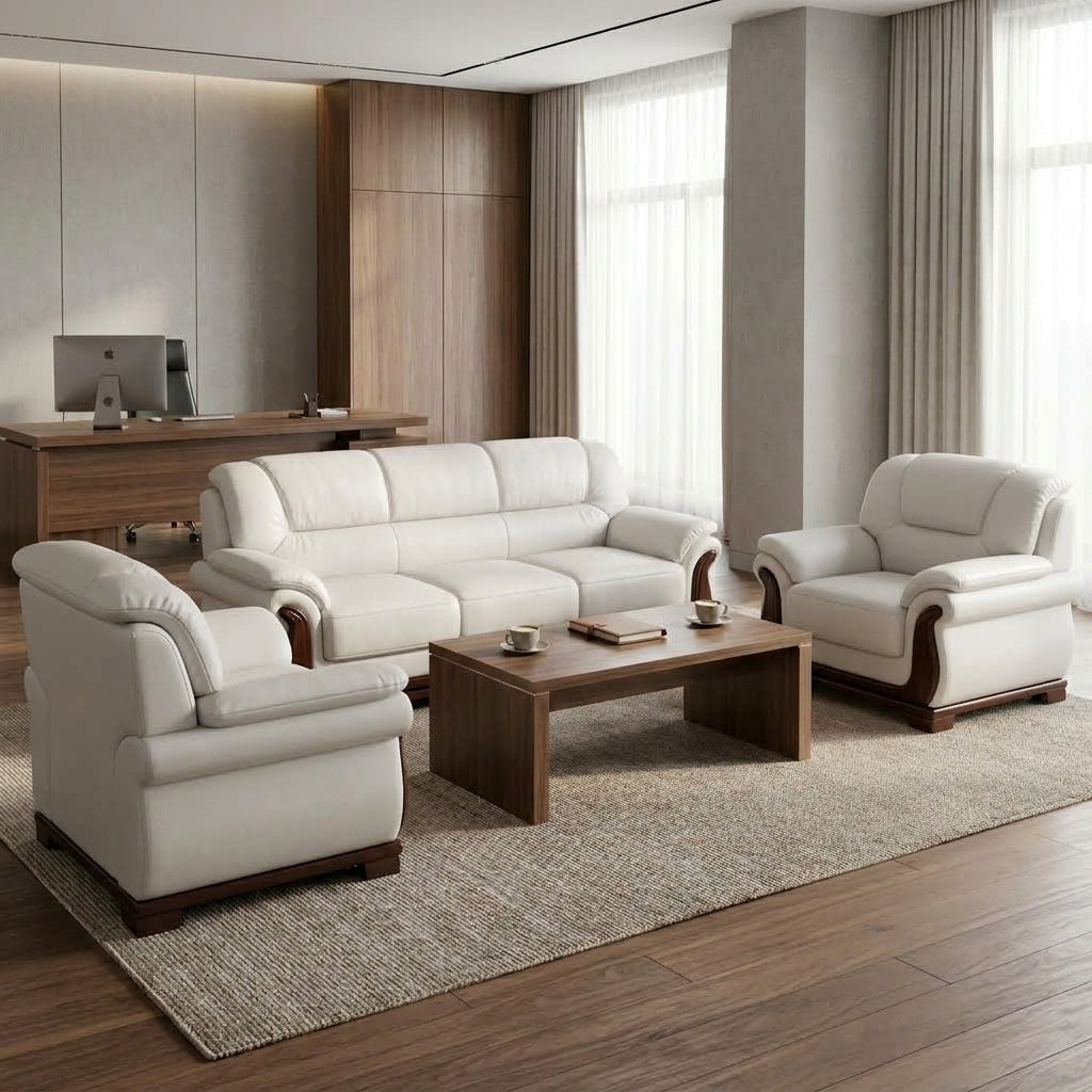 Cream leather 3-seater sofa with matching armchairs and walnut coffee table in a contemporary executive office lounge - RAMA Office Furniture
